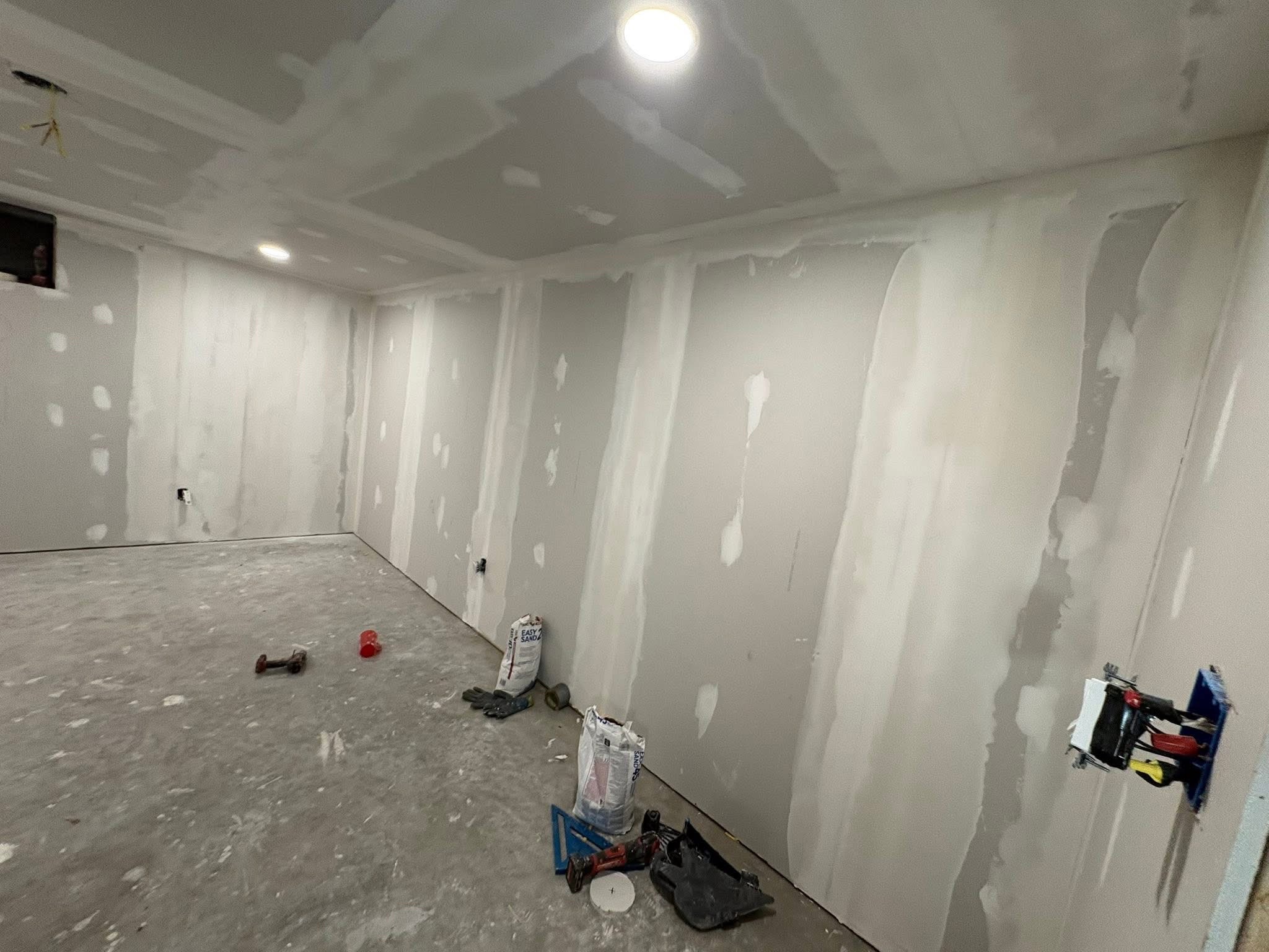 Basement drywall installed and being finished