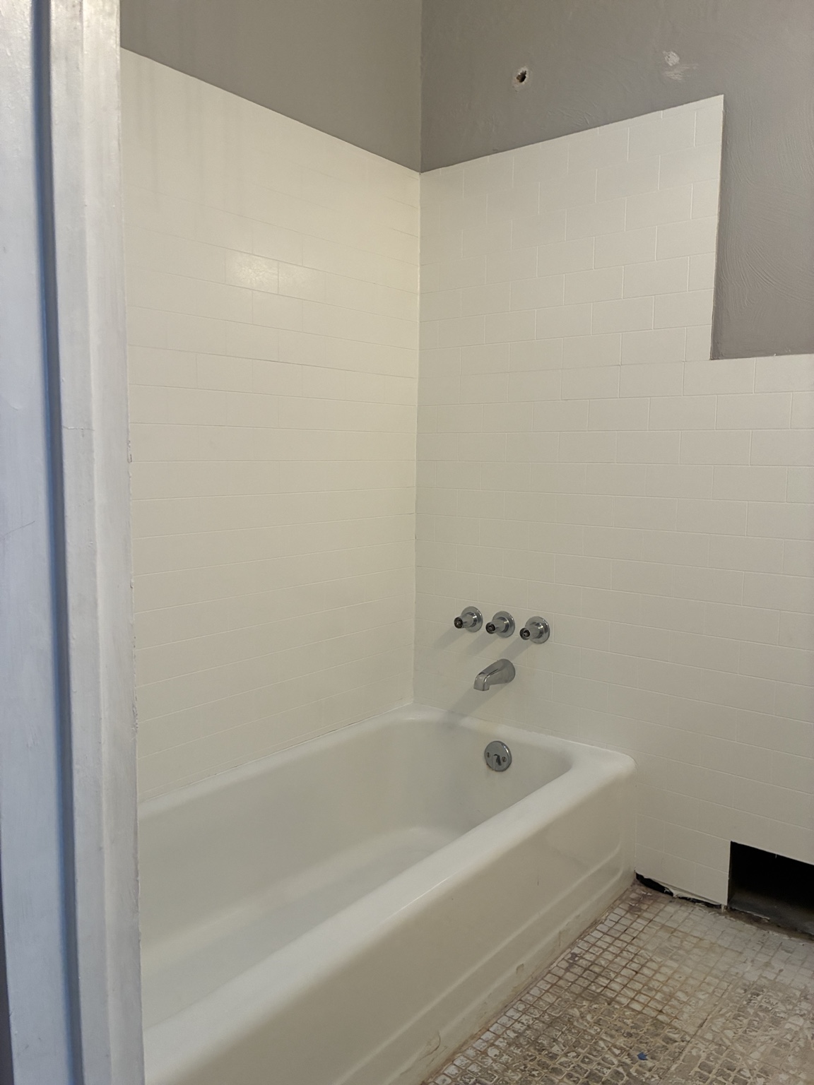 Bathroom tile and tub refinished in white