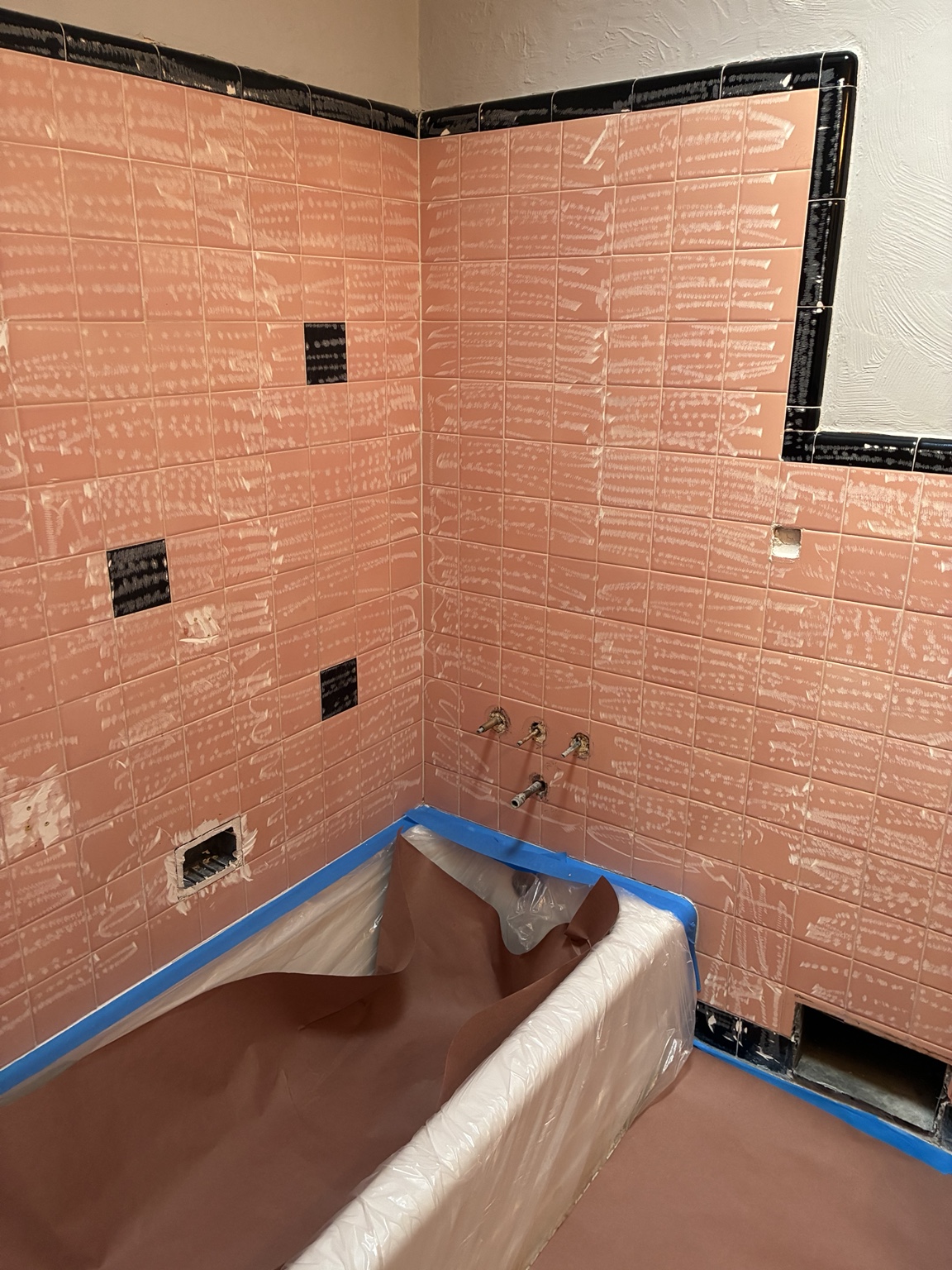 Pink bathroom tile during preparation