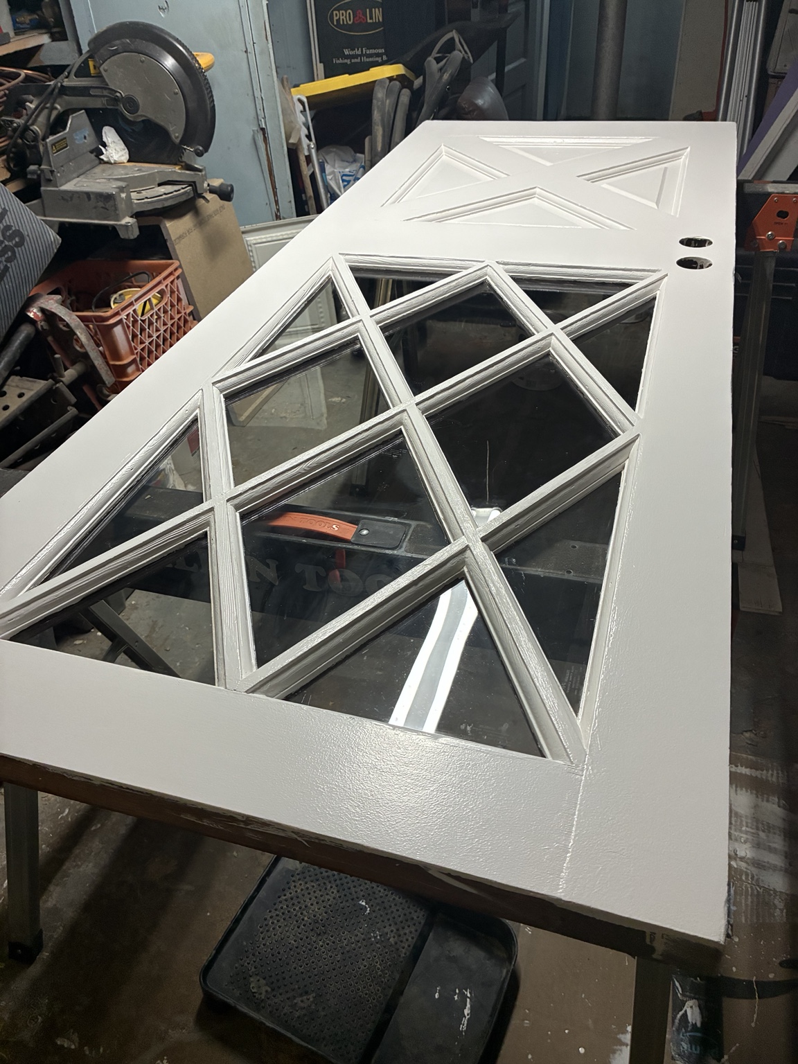 Restored decorative wood and glass door painted white