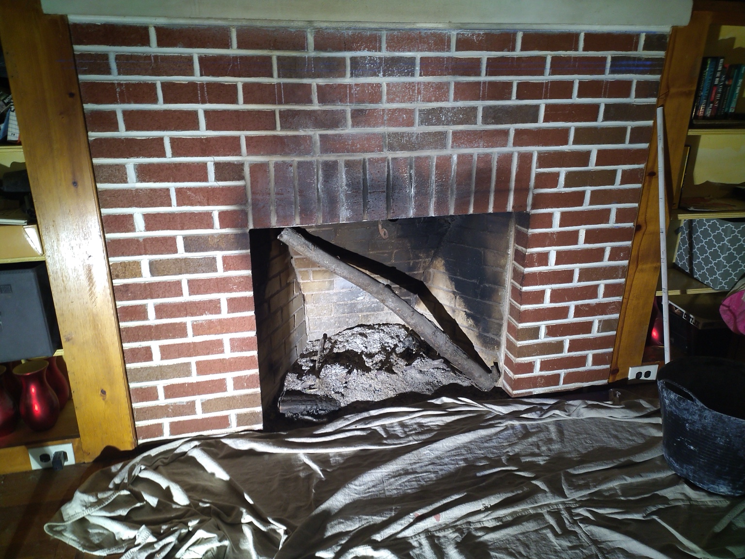 Brick fireplace face rebuilt with clean mortar joints