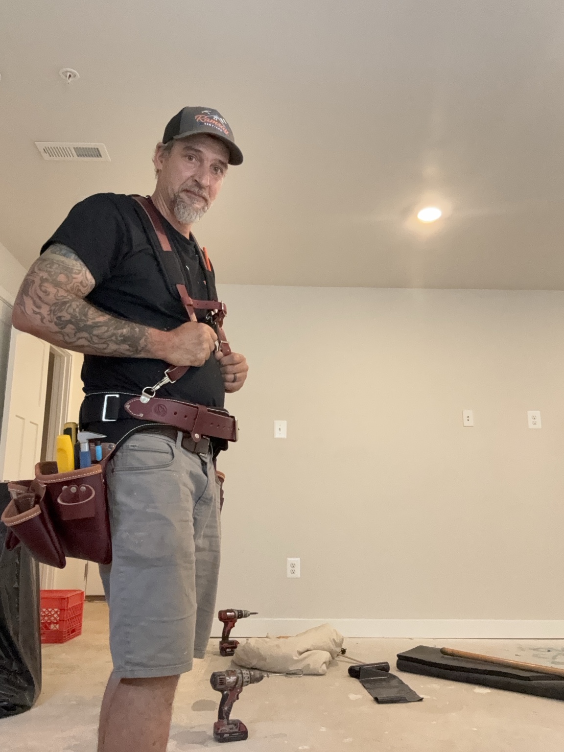 Rob Ramsay wearing his tool belt on a job site